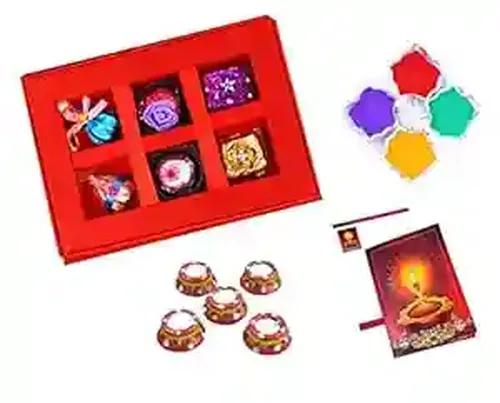 MANTOUSS Diwali Chocolate Gift in Premium Red Satin Box + 2 Matki Wax Filled Diya, Diwali Greeting Card and Rangoli Colours