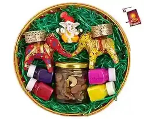 Diwali dry fruits/Diwali dry bruits gift box/Diwali dry fruits box-Decorated basket+60 gms of mix dry fruits in a glass jar+2 elephant candle stand with candles+showpiece figurine+rangoli colours+Card